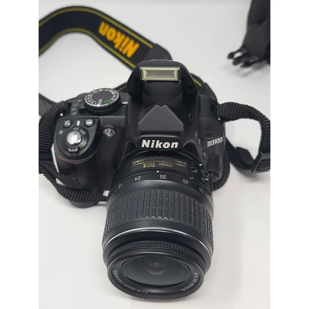 Nikon D3100 DSLR Camera Bundle 18-55mm 35mm 70-300mm Lenses Case Charger